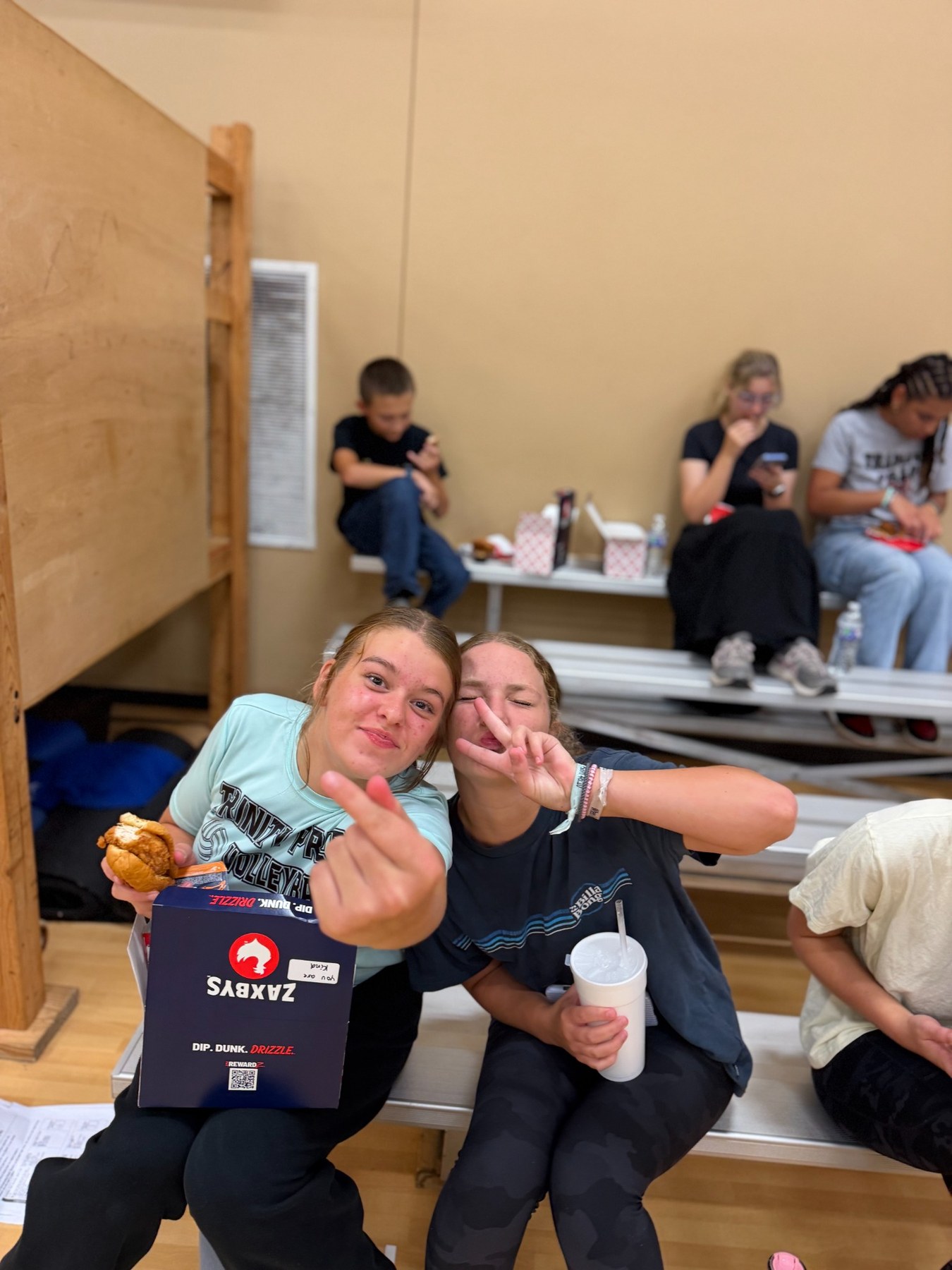 Students smiling during food and fellowship