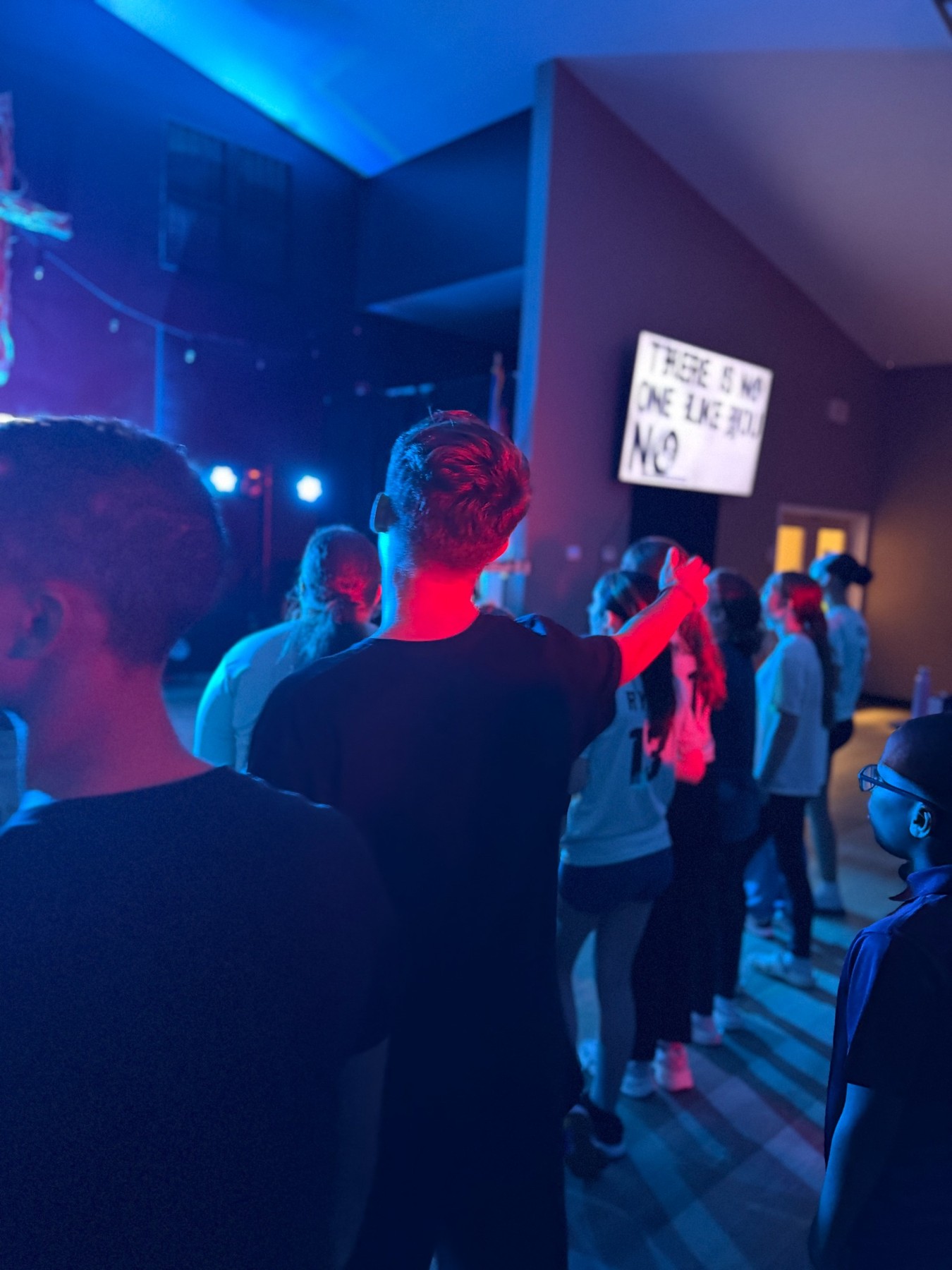 Lions Den students worshiping together